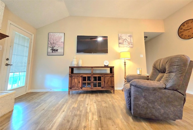 110 Red Bud St, Shepherd, TX 77371 - living room featuring wood finished floors and vaulted ceiling