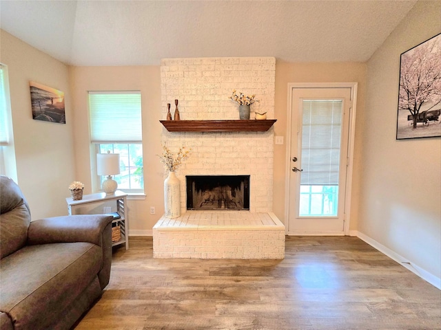 110 Red Bud St, Shepherd, TX 77371 - living room with wood finished floors and a fireplace