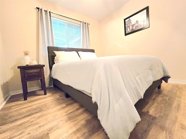110 Red Bud St, Shepherd, TX 77371 - bedroom featuring baseboards and wood finished floors