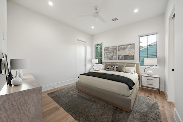 3755 Rice Blvd, Houston, TX 77005 - bedroom featuring multiple windows, light wood-type flooring, recessed lighting, and ceiling fan