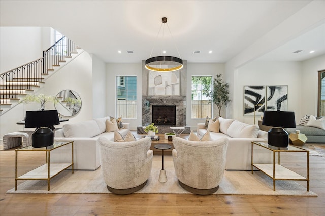 3755 Rice Blvd, Houston, TX 77005 - living area featuring stairs, wood finished floors, recessed lighting, and a high end fireplace