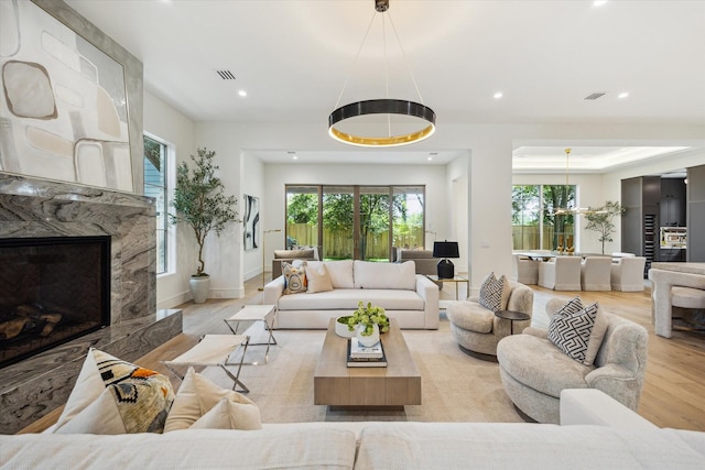3755 Rice Blvd, Houston, TX 77005 - living room featuring wood finished floors, recessed lighting, and a fireplace