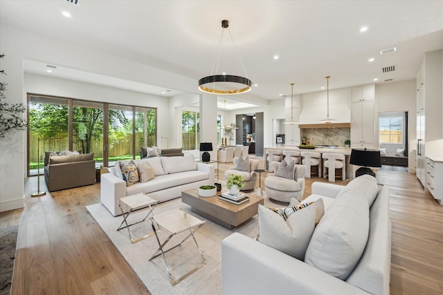 3755 Rice Blvd, Houston, TX 77005 - living room with light wood-style flooring, plenty of natural light, and recessed lighting