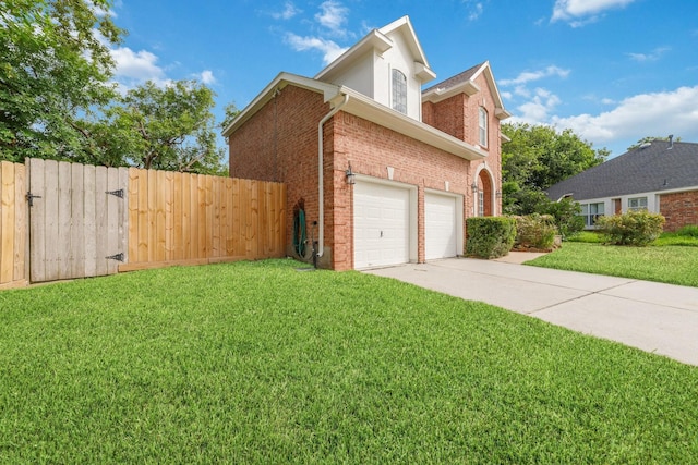 4444 Victory Dr Unit 26, Houston, TX 77088 - view of property exterior with driveway, brick siding, and a garage