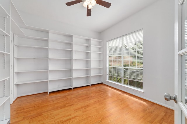4444 Victory Dr Unit 26, Houston, TX 77088 - unfurnished room featuring ceiling fan, plenty of natural light, light wood-style floors, and built in features