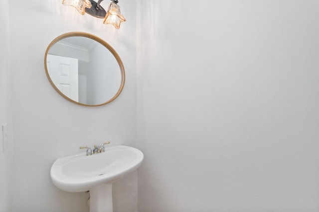 4444 Victory Dr Unit 26, Houston, TX 77088 - bathroom featuring ornamental molding and a sink