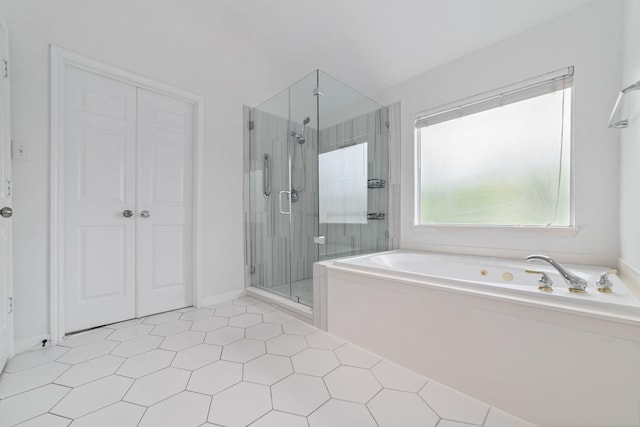 4444 Victory Dr Unit 26, Houston, TX 77088 - full bath with a bath, a shower stall, and tile patterned floors