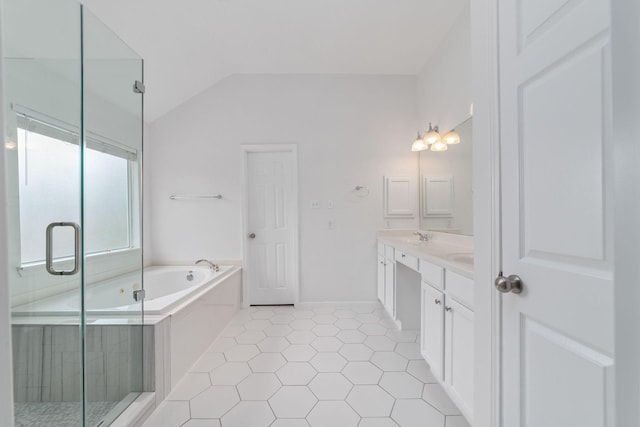 4444 Victory Dr Unit 26, Houston, TX 77088 - bathroom featuring double vanity, a bath, a shower stall, lofted ceiling, and tile patterned flooring