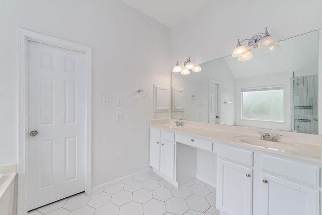 4444 Victory Dr Unit 26, Houston, TX 77088 - full bathroom with double vanity, lofted ceiling, and tile patterned floors