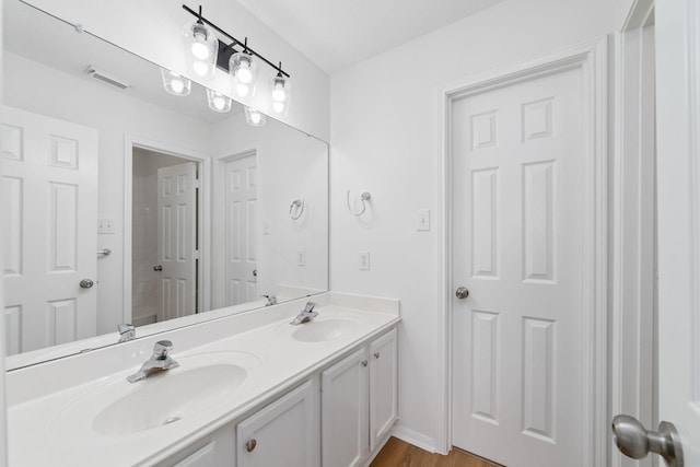 4444 Victory Dr Unit 26, Houston, TX 77088 - bathroom with double vanity and wood finished floors