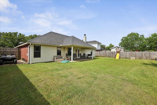 505 Shannons Way, Bridge City, TX 77611 - back of property with a patio area, a fenced backyard, and a shingled roof