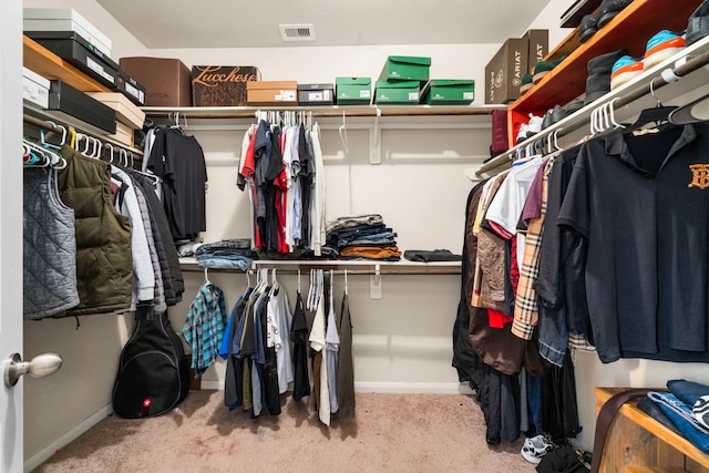 9422 Cimarroncito Ln, Humble, TX 77396 - walk in closet with carpet flooring