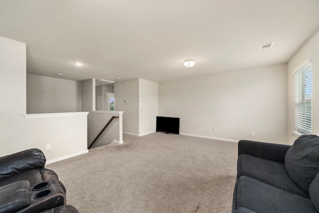 9422 Cimarroncito Ln, Humble, TX 77396 - carpeted living room featuring baseboards and recessed lighting