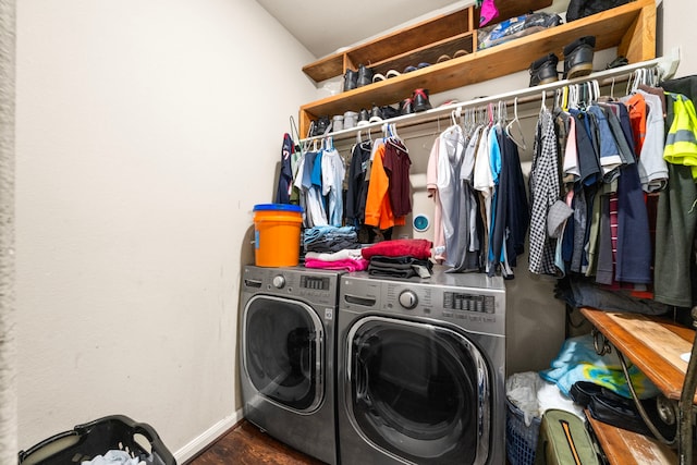 9422 Cimarroncito Ln, Humble, TX 77396 - laundry area featuring washer and clothes dryer and wood finished floors