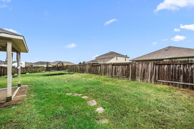 9422 Cimarroncito Ln, Humble, TX 77396 - fenced backyard featuring a trampoline