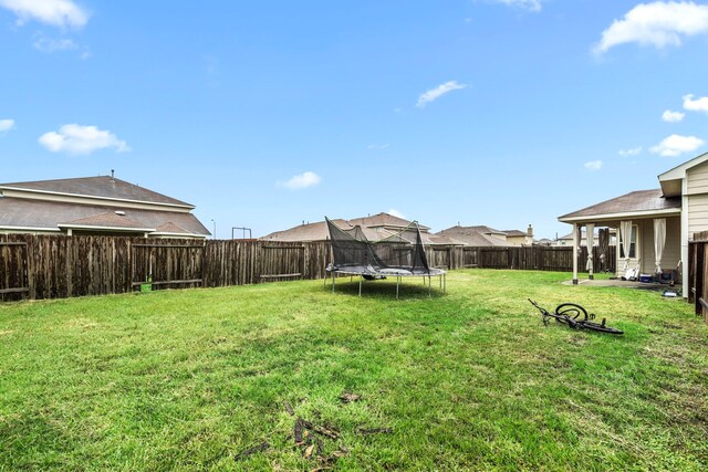 9422 Cimarroncito Ln, Humble, TX 77396 - fenced backyard featuring a trampoline