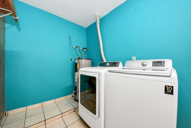 6102 S Briar Bayou Dr, Houston, TX 77072 - washroom with electric water heater, independent washer and dryer, and light tile patterned floors