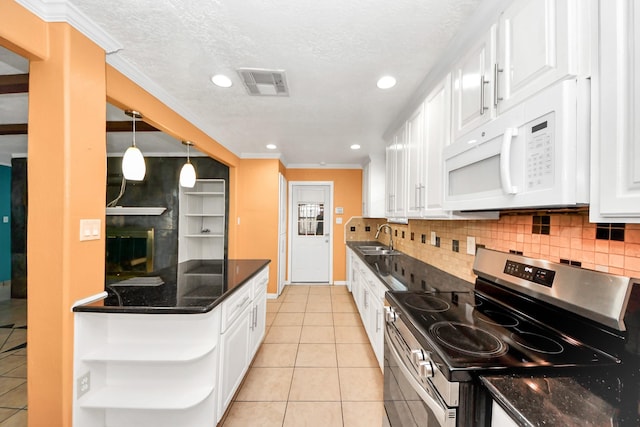 6102 S Briar Bayou Dr, Houston, TX 77072 - kitchen with stainless steel electric range, white microwave, open shelves, white cabinetry, and light tile patterned floors