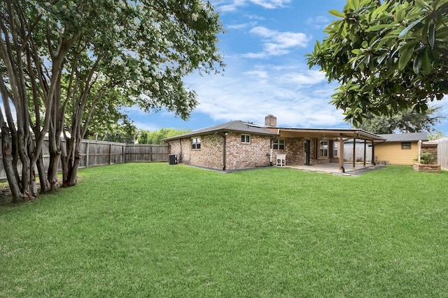 6102 S Briar Bayou Dr, Houston, TX 77072 - rear view of house featuring a patio area, brick siding, a chimney, and a fenced backyard