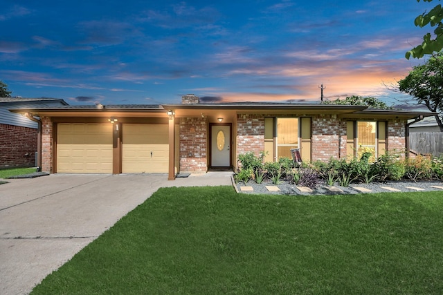 6102 S Briar Bayou Dr, Houston, TX 77072 - view of front of house with an attached garage, brick siding, concrete driveway, and a yard