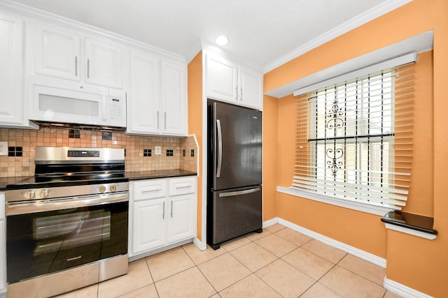 6102 S Briar Bayou Dr, Houston, TX 77072 - kitchen featuring white microwave, freestanding refrigerator, stainless steel electric range, white cabinets, and crown molding