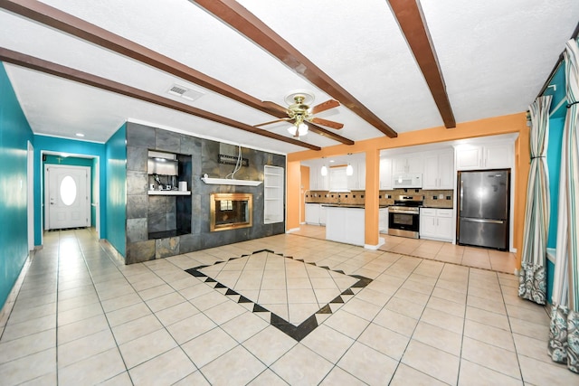 6102 S Briar Bayou Dr, Houston, TX 77072 - unfurnished living room with light tile patterned floors, a ceiling fan, beam ceiling, and a tiled fireplace