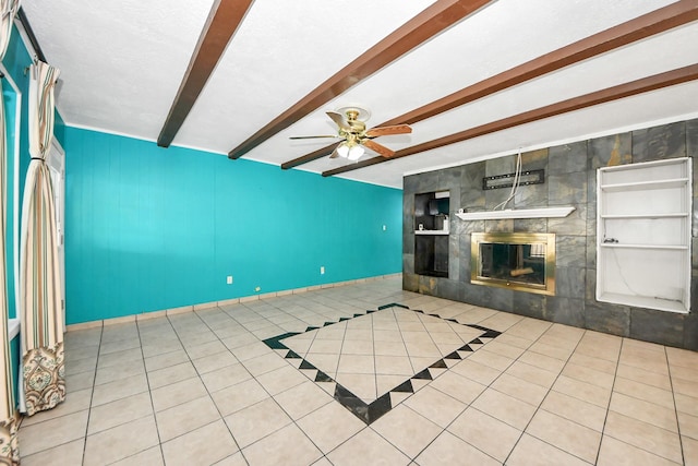 6102 S Briar Bayou Dr, Houston, TX 77072 - unfurnished living room with tile patterned flooring, beamed ceiling, ceiling fan, and a fireplace