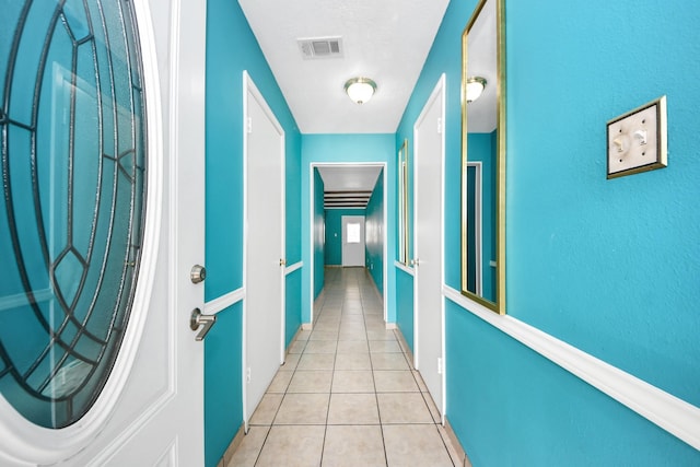 6102 S Briar Bayou Dr, Houston, TX 77072 - hallway with light tile patterned floors