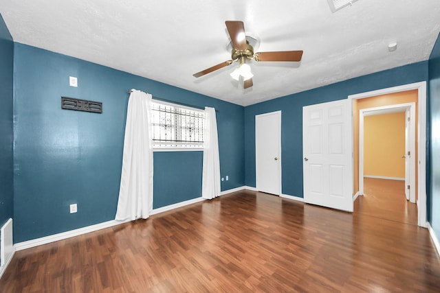 6102 S Briar Bayou Dr, Houston, TX 77072 - unfurnished bedroom featuring wood finished floors, ceiling fan, and a closet