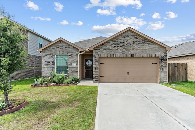 10731 Spring Brook Pass Dr, Humble, TX 77396 - view of front of property featuring a garage, concrete driveway, and brick siding