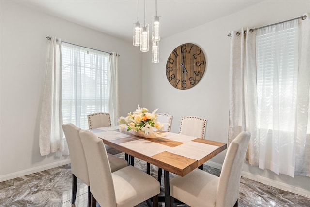 10731 Spring Brook Pass Dr, Humble, TX 77396 - dining area with light marble finish flooring and baseboards