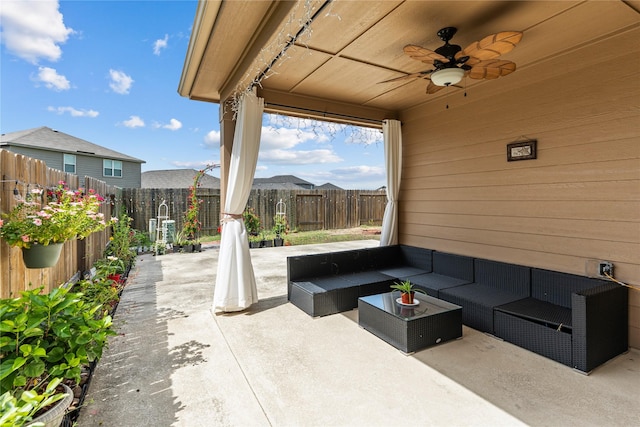 10731 Spring Brook Pass Dr, Humble, TX 77396 - fenced backyard featuring a patio, ceiling fan, and an outdoor hangout area