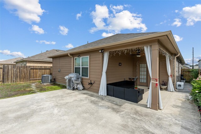 10731 Spring Brook Pass Dr, Humble, TX 77396 - back of house featuring a patio area, a fenced backyard, an outdoor living space, and roof with shingles