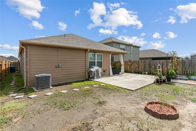 10731 Spring Brook Pass Dr, Humble, TX 77396 - back of house with a patio area, a fenced backyard, and a shingled roof