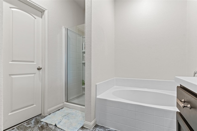 10731 Spring Brook Pass Dr, Humble, TX 77396 - bathroom featuring a bath, a stall shower, and vanity