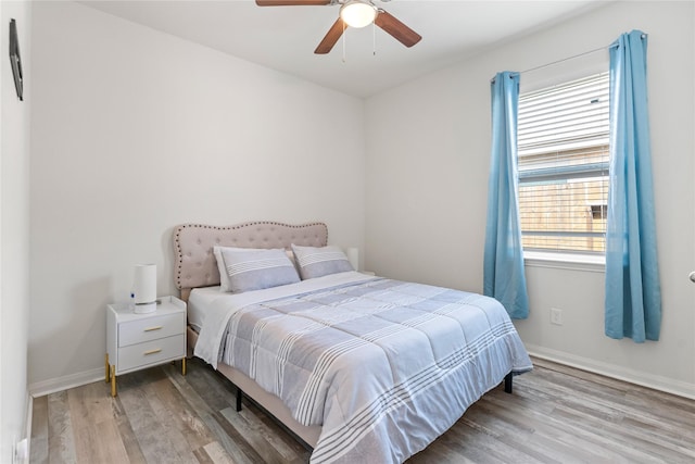 10731 Spring Brook Pass Dr, Humble, TX 77396 - bedroom featuring wood finished floors and a ceiling fan