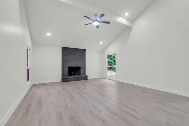 1602 Pine Oak Dr, Conroe, TX 77304 - unfurnished living room featuring a fireplace, beam ceiling, light wood-style flooring, high vaulted ceiling, and a ceiling fan
