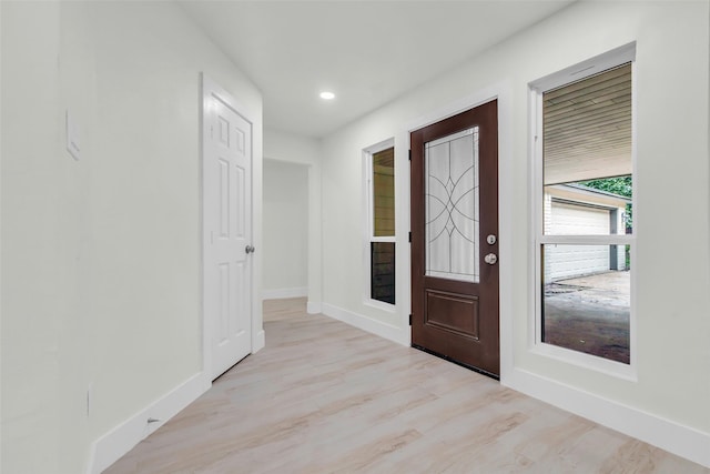 1602 Pine Oak Dr, Conroe, TX 77304 - foyer entrance featuring light wood finished floors and recessed lighting