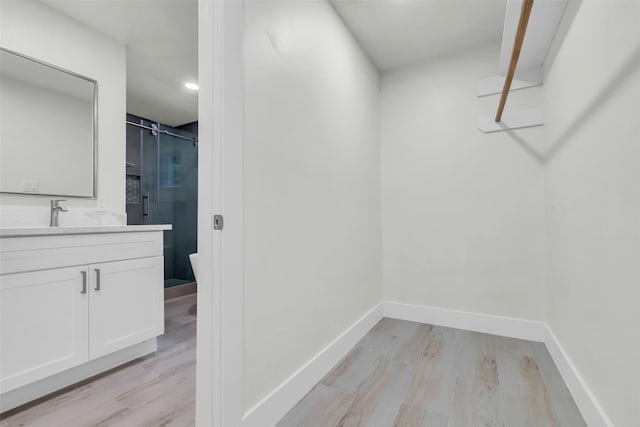 1602 Pine Oak Dr, Conroe, TX 77304 - walk in closet with light wood finished floors