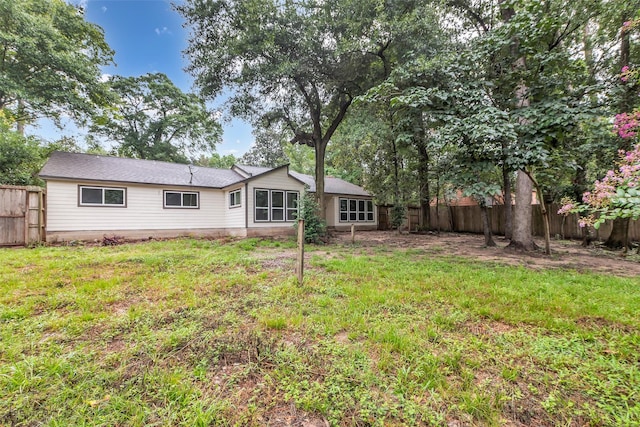 1602 Pine Oak Dr, Conroe, TX 77304 - back of property featuring a fenced backyard
