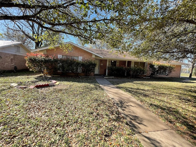 1901 Greenbrook Pkwy, Austin, TX 78723 - single story home featuring brick siding and a front lawn