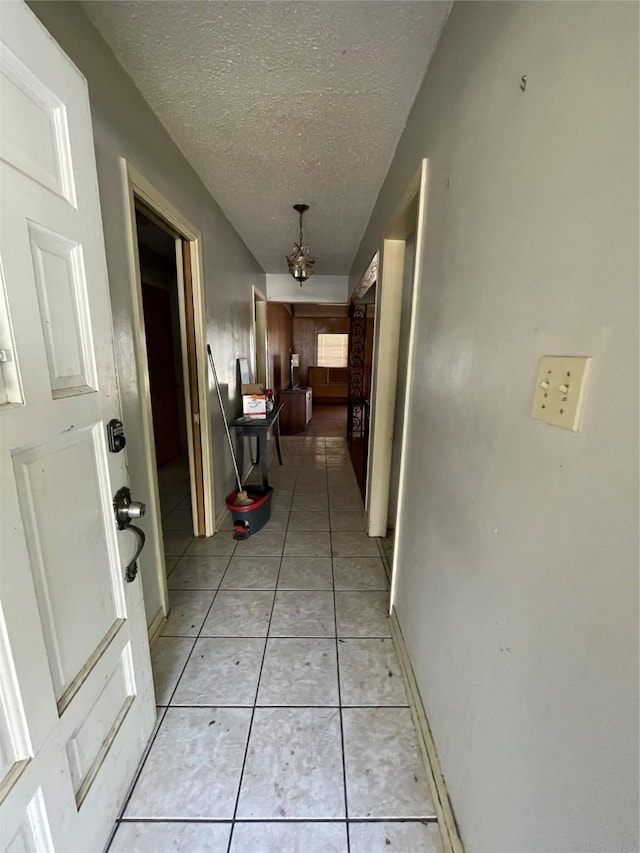 1901 Greenbrook Pkwy, Austin, TX 78723 - hall featuring a textured ceiling and light tile patterned floors