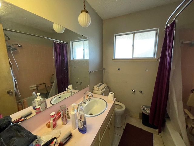 1901 Greenbrook Pkwy, Austin, TX 78723 - full bathroom featuring tile patterned floors, vanity, and shower / tub combo with curtain