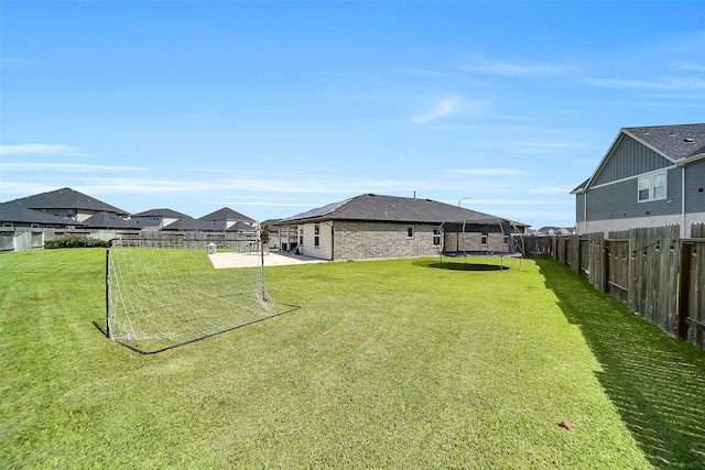 3330 Dagostino Creek Dr, Katy, TX 77494 - fenced backyard featuring a trampoline, a patio area, and a residential view