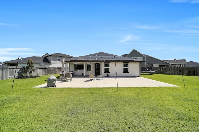 3330 Dagostino Creek Dr, Katy, TX 77494 - back of house with roof mounted solar panels, a patio area, and a fenced backyard