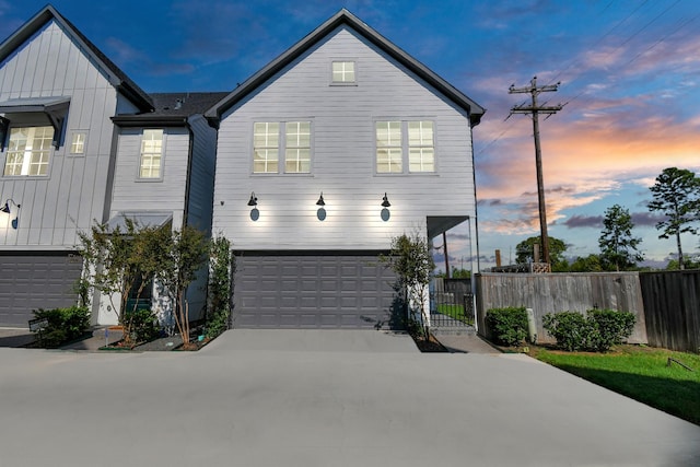 3302 Timbergrove Heights St, Houston, TX 77008 - view of front of property featuring board and batten siding, a garage, concrete driveway, and a gate
