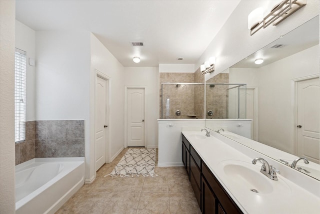 20838 Morgan Knoll Ln, Katy, TX 77449 - full bath featuring double vanity, a garden tub, a tile shower, and tile patterned flooring