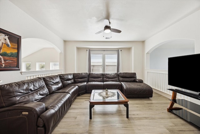 20838 Morgan Knoll Ln, Katy, TX 77449 - living area with ceiling fan, plenty of natural light, light wood-style floors, and arched walkways