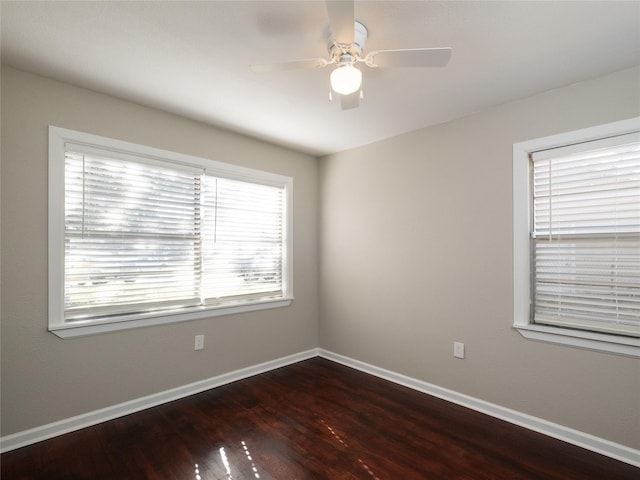 3215 Soway St, Houston, TX 77080 - empty room with dark wood-style flooring and ceiling fan