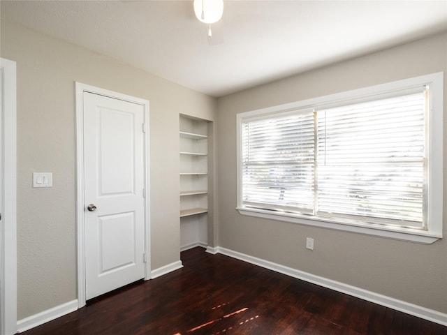 3215 Soway St, Houston, TX 77080 - unfurnished bedroom with dark wood-type flooring and baseboards
